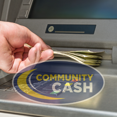 Hand receiving cash from ATM with Community Cash logo.